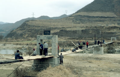community work: repairing a bridge, but at a pace that it will take a year or so