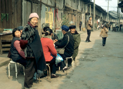 Elderly enjoying the springtime sun in an authentical village setting
