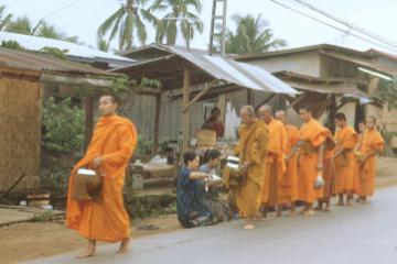 Though a communist country Laos is favouring Buddhism now and you see monks begging for food in the early morning
