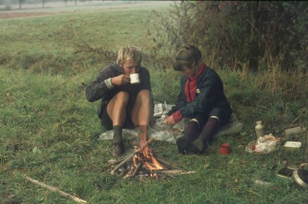 Cold weather in autumn in Germany, warming up at small woodfire