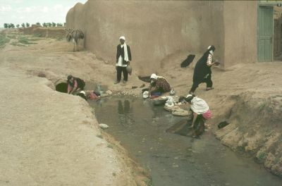 Washing at the brook in an Iranian mud village